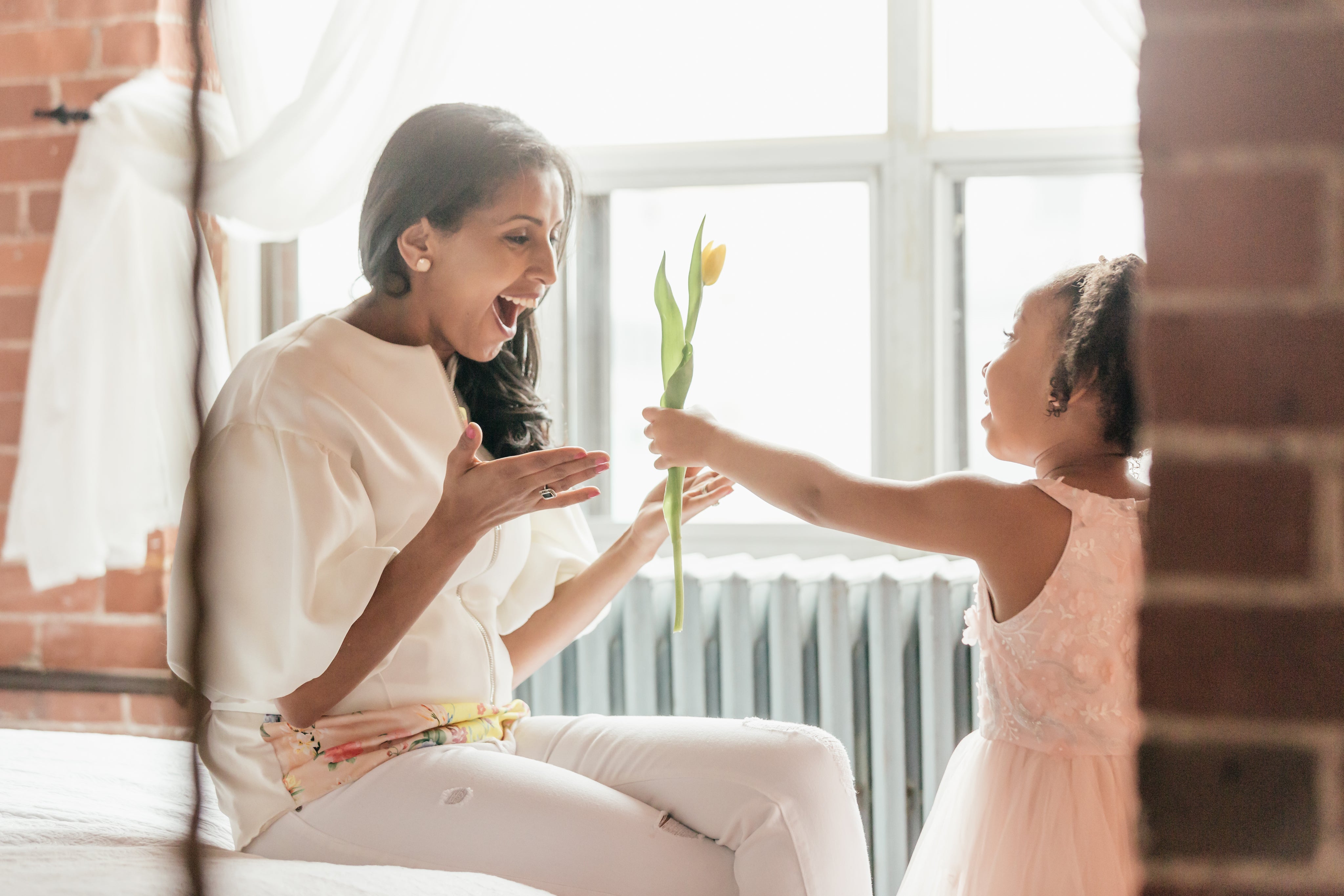 files/daughter-suprises-mom-with-tulip.jpg